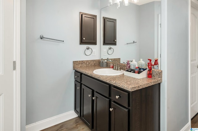 bathroom with vanity and hardwood / wood-style floors