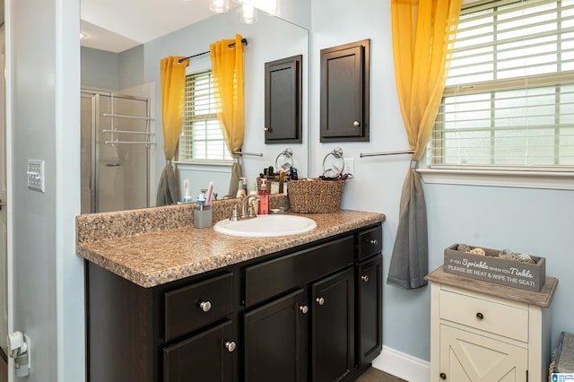 bathroom with vanity and walk in shower