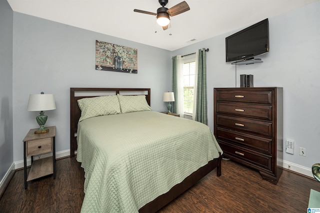 bedroom with dark wood-type flooring and ceiling fan