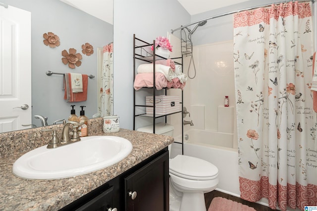 full bathroom with vanity, toilet, and shower / tub combo with curtain