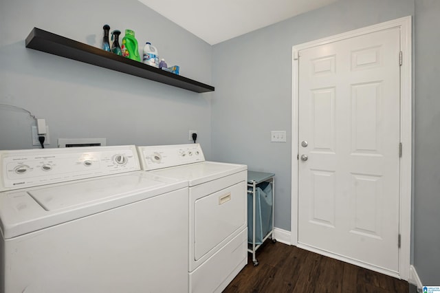 washroom featuring dark wood-type flooring and washer and dryer