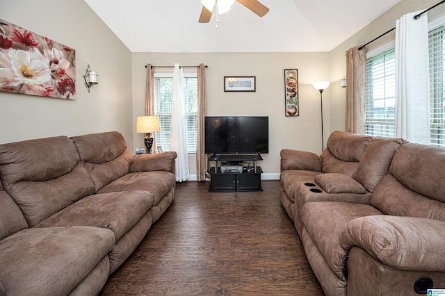 living room featuring a wealth of natural light, dark wood-type flooring, ceiling fan, and lofted ceiling