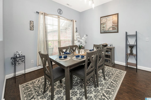 dining room with dark hardwood / wood-style flooring