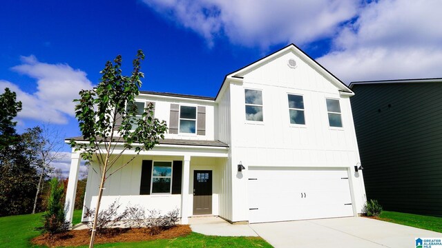 view of front of house featuring a front lawn and a garage