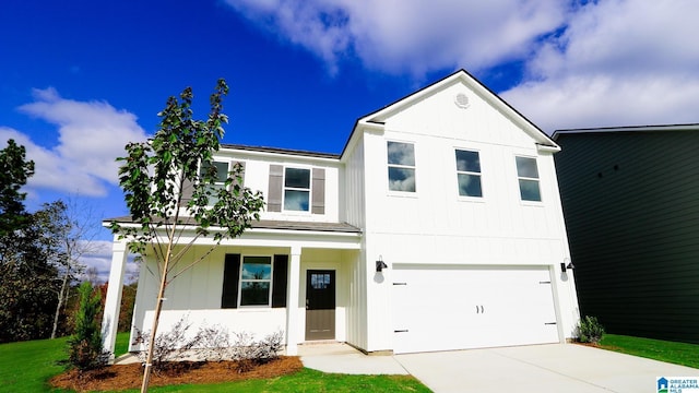 view of front of house featuring a front lawn and a garage