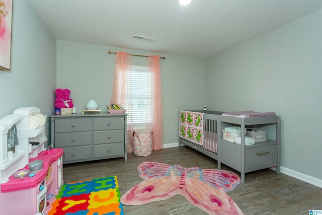 bedroom with hardwood / wood-style floors