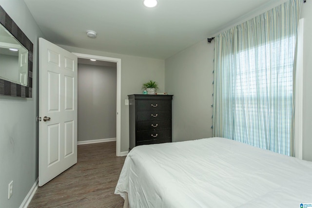 bedroom with hardwood / wood-style floors