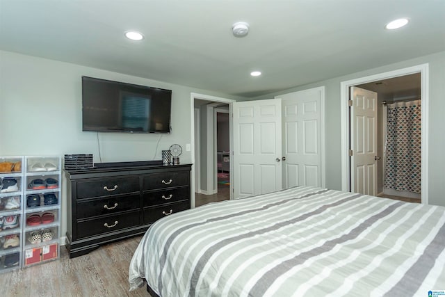 bedroom featuring light hardwood / wood-style flooring and a closet