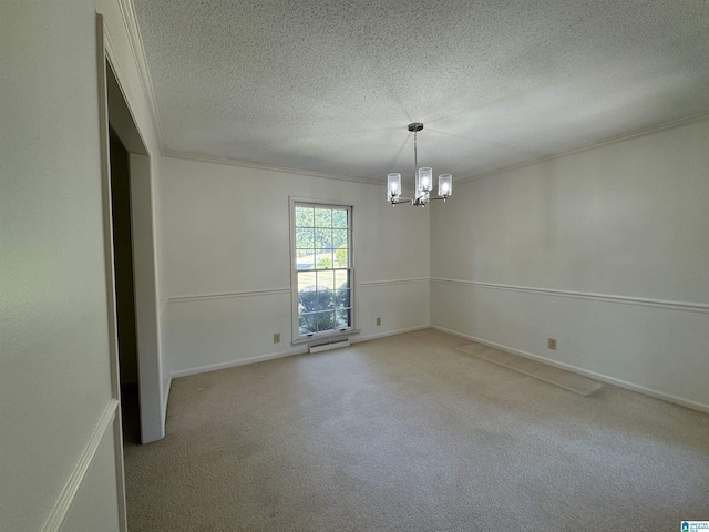 unfurnished room with a textured ceiling, a notable chandelier, light carpet, baseboards, and crown molding