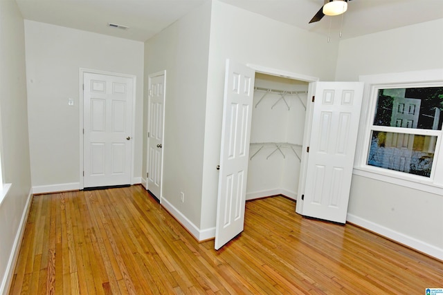 unfurnished bedroom featuring ceiling fan and light hardwood / wood-style floors