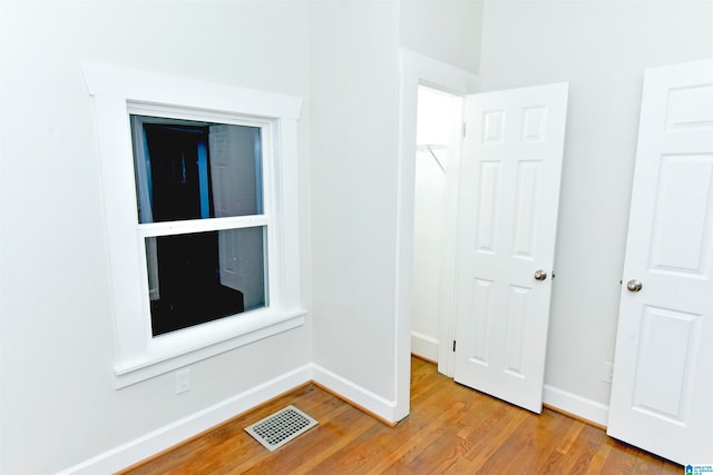 spare room featuring light wood-type flooring