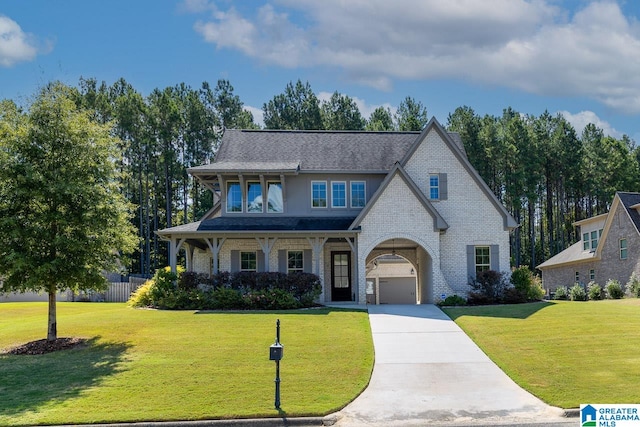 view of front facade with a garage and a front yard