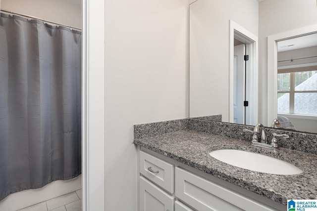 bathroom with vanity and tile patterned floors