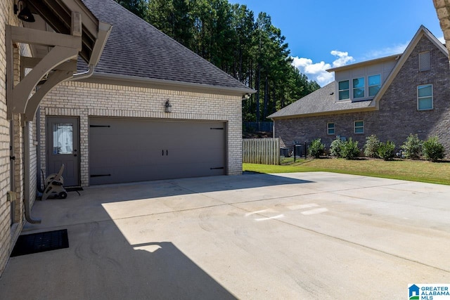 view of side of home featuring a yard