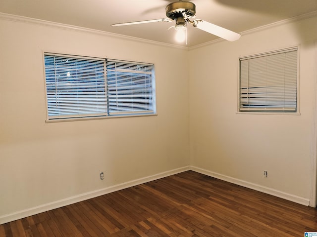 spare room with ceiling fan, dark wood-type flooring, crown molding, and baseboards