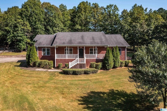 ranch-style house with a front yard and a porch