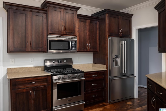 kitchen featuring ornamental molding, appliances with stainless steel finishes, light stone counters, and dark hardwood / wood-style floors