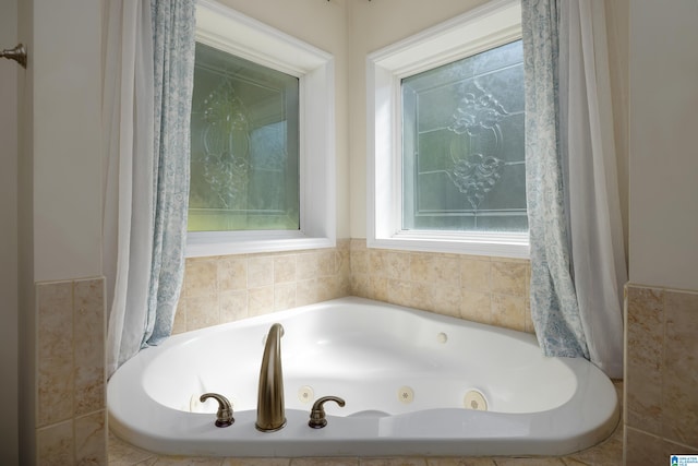 bathroom featuring tiled bath