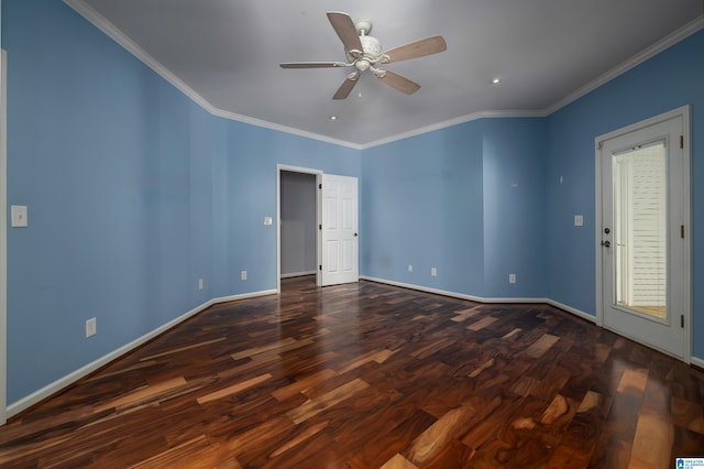 empty room with crown molding, dark wood-type flooring, and ceiling fan