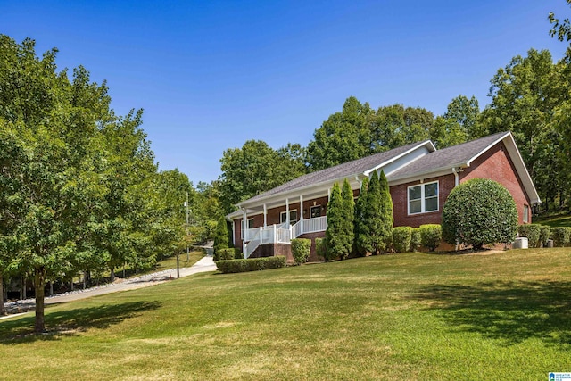 ranch-style house with a front lawn