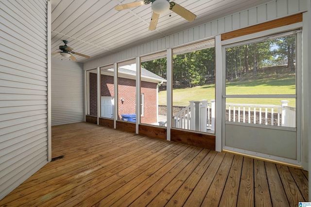 unfurnished sunroom with ceiling fan and wood ceiling