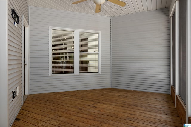 unfurnished sunroom with ceiling fan and wood ceiling