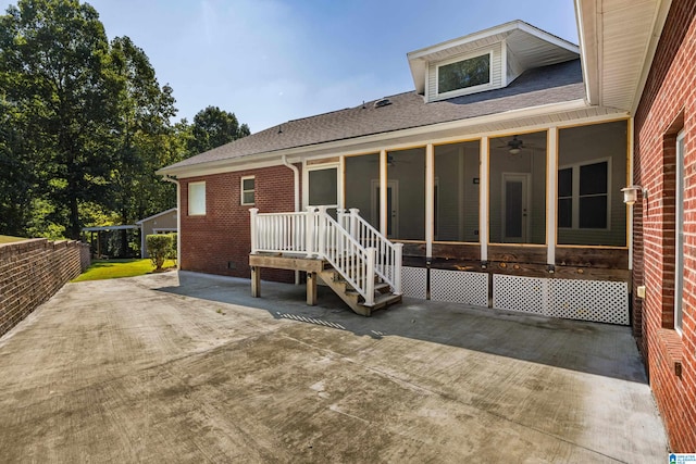 back of house with ceiling fan