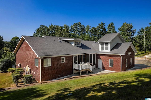 back of house featuring a yard