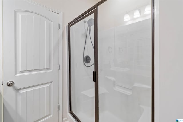 bathroom with an enclosed shower