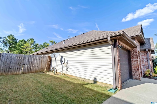 view of home's exterior featuring a yard and a garage