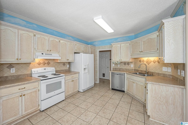 kitchen featuring white appliances, light tile patterned floors, ornamental molding, and sink