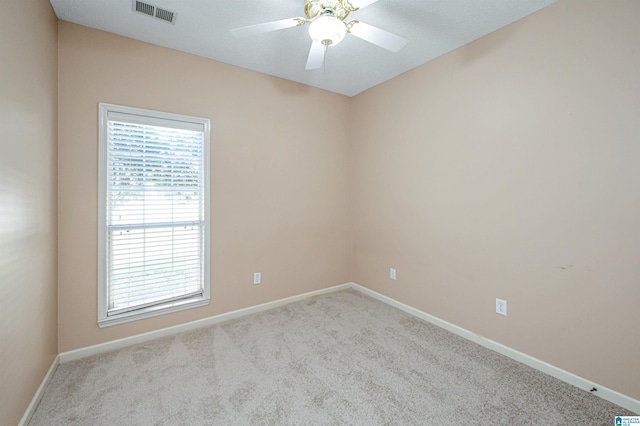 carpeted empty room with ceiling fan