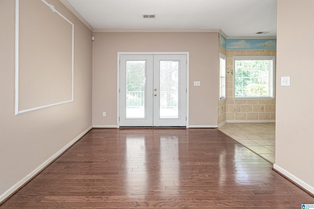 doorway to outside featuring ornamental molding, hardwood / wood-style floors, and french doors