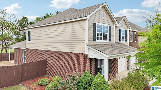 view of side of home with a garage