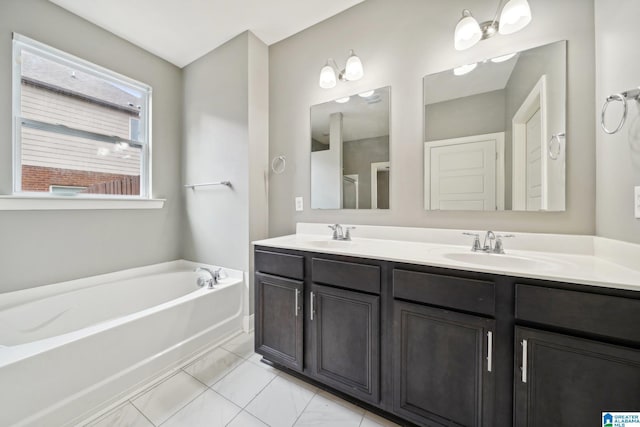 bathroom with a sink, a bath, and double vanity