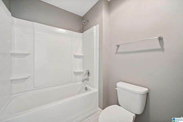 bathroom with tile patterned flooring and toilet