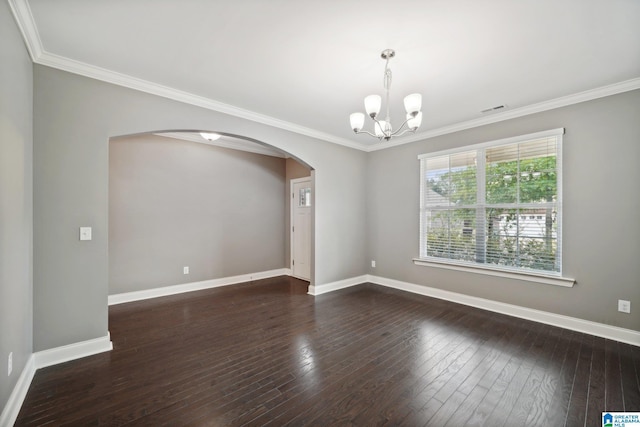 unfurnished room featuring visible vents, ornamental molding, arched walkways, baseboards, and dark wood-style flooring