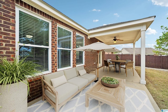 view of patio / terrace with an outdoor living space, outdoor dining area, fence, and ceiling fan