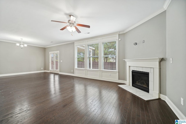 unfurnished living room featuring baseboards, wood-type flooring, ornamental molding, and a fireplace