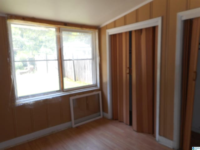 unfurnished bedroom featuring light wood-style floors