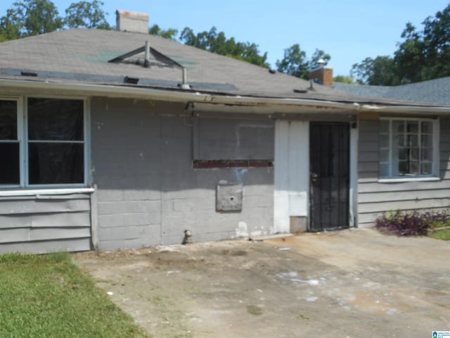 exterior space featuring a chimney