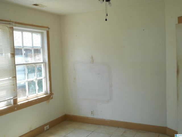 empty room with visible vents and baseboards