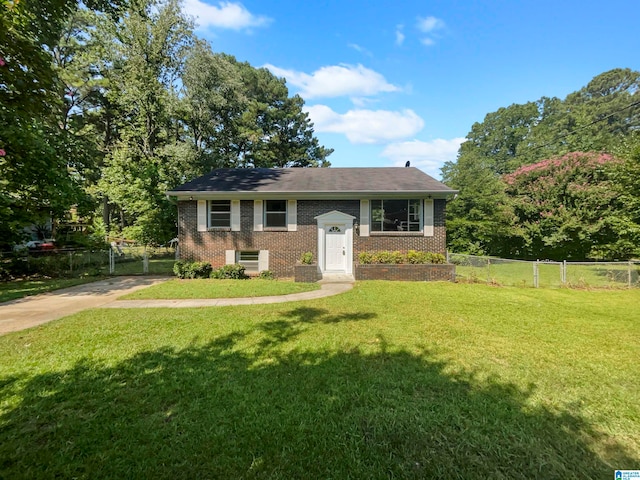 raised ranch with a front lawn