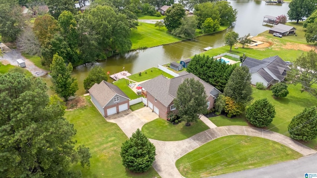 birds eye view of property with a water view and a residential view