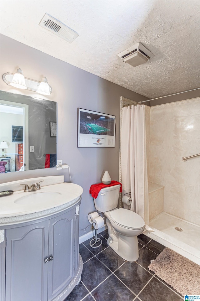 bathroom featuring a textured ceiling, toilet, visible vents, a shower stall, and tile patterned floors