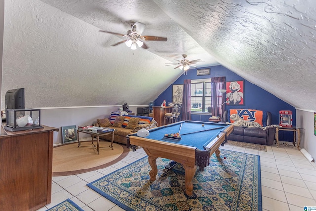 playroom with light tile patterned floors, vaulted ceiling, billiards, and a textured ceiling