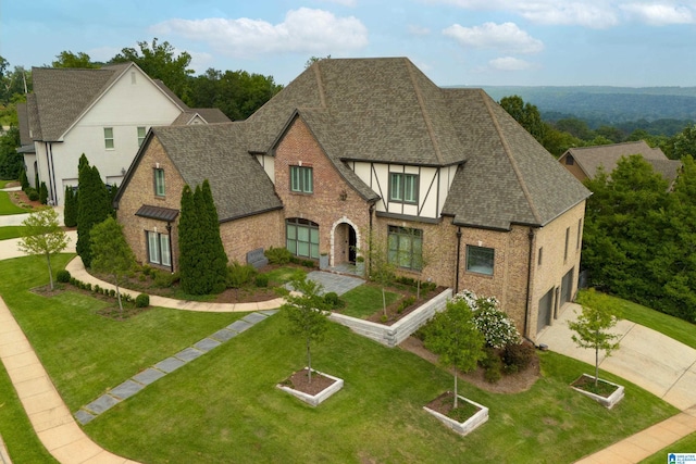 tudor house with a front yard