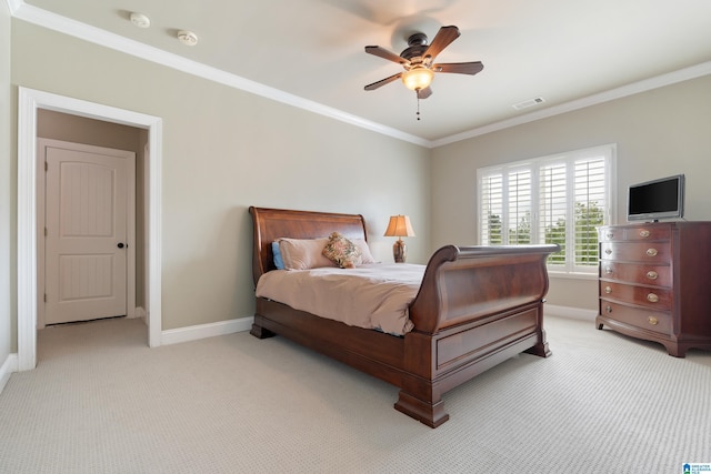 bedroom featuring visible vents, baseboards, light colored carpet, and ornamental molding