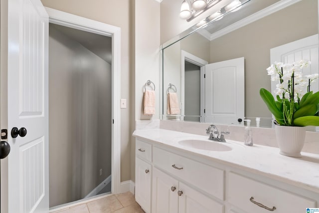 bathroom featuring tile patterned floors, vanity, and crown molding