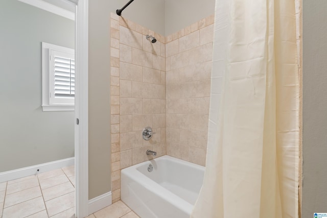 full bath with tile patterned floors, baseboards, and shower / tub combo with curtain